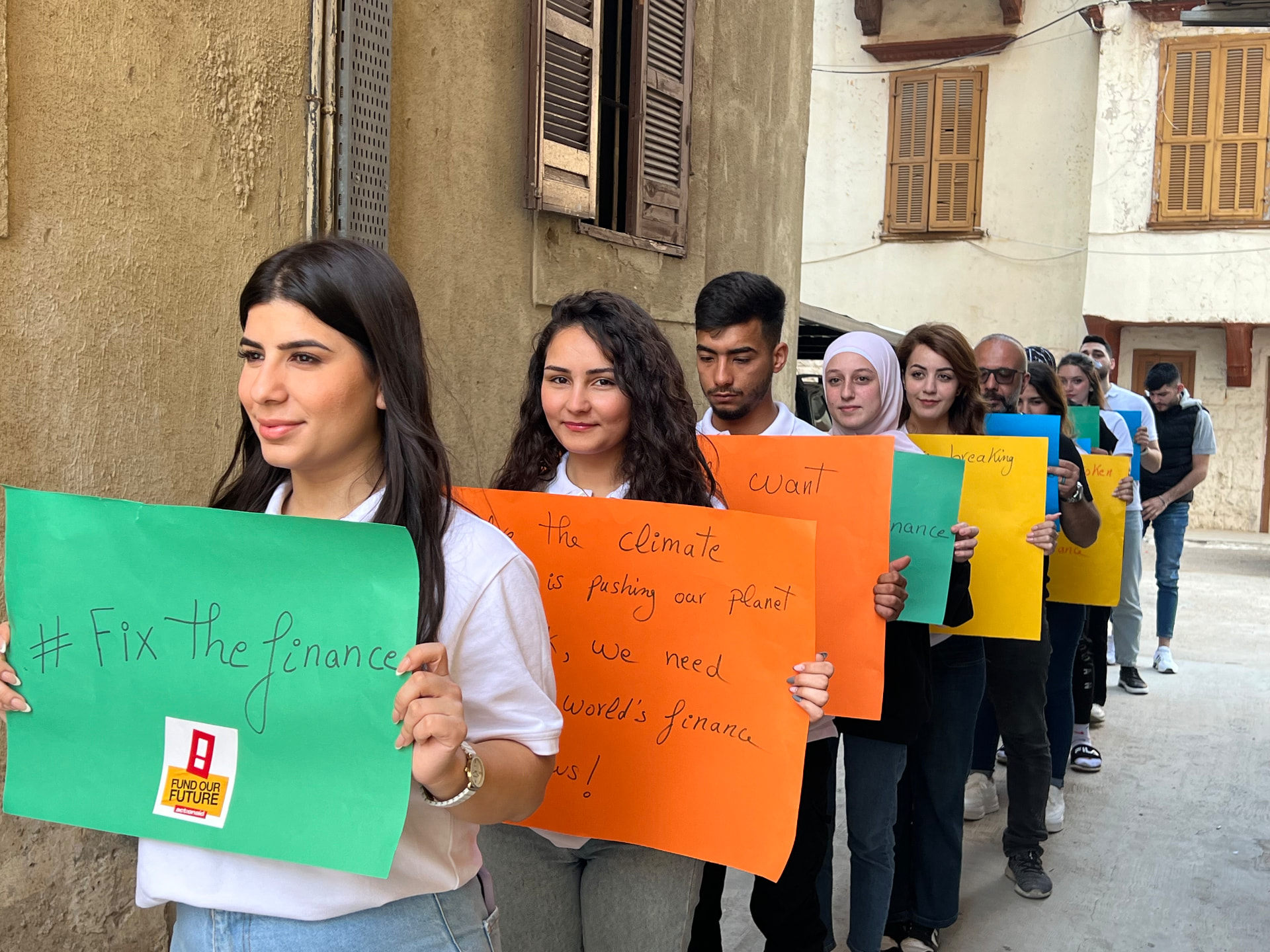 YARD youth marching with handmade climate justice placards in Tripoli
